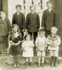 The children in front of the farm house, circa 1915
